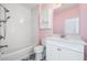 Bathroom featuring a white vanity, tub, and geometric tile flooring at 2111 Bellrick Nw Rd, Atlanta, GA 30318