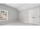Bedroom with double door closet, neutral carpet, neutral walls, and natural light at 2111 Bellrick Nw Rd, Atlanta, GA 30318