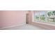 Bright bedroom with a pink color scheme and large windows at 2111 Bellrick Nw Rd, Atlanta, GA 30318