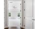 Bedroom featuring walk-in closet, tray ceiling, ceiling fan, and natural light at 2111 Bellrick Nw Rd, Atlanta, GA 30318