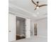 Bright bedroom featuring carpet flooring, trey ceiling, a ceiling fan, and view to the ensuite bathroom at 2111 Bellrick Nw Rd, Atlanta, GA 30318