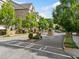 Gated townhome community entrance featuring mature landscaping and professionally maintained grounds at 2111 Bellrick Nw Rd, Atlanta, GA 30318