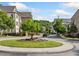 Attractive fountain featured in a gated townhome community entrance with lush landscaping at 2111 Bellrick Nw Rd, Atlanta, GA 30318