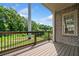 Exterior view from the wooden deck with railing and brick home exterior at 2111 Bellrick Nw Rd, Atlanta, GA 30318