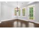 Open dining room features hardwood floors, and access to the rear balcony through french doors at 2111 Bellrick Nw Rd, Atlanta, GA 30318
