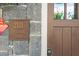 Close up view of the front door and address plaque with stone accents at 2111 Bellrick Nw Rd, Atlanta, GA 30318