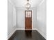 Bright entryway with a hardwood floor, chandelier, and a view of the front door at 2111 Bellrick Nw Rd, Atlanta, GA 30318