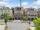 Charming street view of a three-story brick home with balconies on a sunny day at 2111 Bellrick Nw Rd, Atlanta, GA 30318