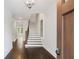 Elegant foyer featuring hardwood floors, staircase, and natural light at 2111 Bellrick Nw Rd, Atlanta, GA 30318