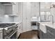 Beautiful kitchen with stainless steel appliances, light gray cabinets, and hardwood floors at 2111 Bellrick Nw Rd, Atlanta, GA 30318