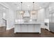 Spacious white kitchen with a large island and stainless steel appliances at 2111 Bellrick Nw Rd, Atlanta, GA 30318