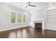 Spacious living room featuring a fireplace with custom built-in shelving and cabinetry at 2111 Bellrick Nw Rd, Atlanta, GA 30318