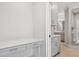 Office featuring built-in desk and shelving. Adjacent bathroom is also visible at 2111 Bellrick Nw Rd, Atlanta, GA 30318