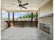 Exterior patio with ceiling fan and fireplace at 2111 Bellrick Nw Rd, Atlanta, GA 30318