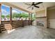 Exterior patio with ceiling fan and fireplace at 2111 Bellrick Nw Rd, Atlanta, GA 30318