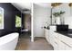 Modern bathroom with soaking tub, glass shower, and double vanity with sleek fixtures at 2808 Hosea L Williams Dr, Atlanta, GA 30317