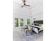 Bright bedroom features a ceiling fan, sitting area, balcony, and ample natural light at 2808 Hosea L Williams Dr, Atlanta, GA 30317