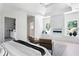 Spacious bedroom with unique architectural details, a modern fireplace, and cozy seating area at 2808 Hosea L Williams Dr, Atlanta, GA 30317