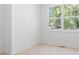 An empty bedroom with a window and wood flooring at 2808 Hosea L Williams Dr, Atlanta, GA 30317