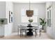 Bright dining area with modern table and chairs, complemented by natural light and stylish decor at 2808 Hosea L Williams Dr, Atlanta, GA 30317