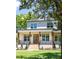 Inviting two-story home boasting a brick porch, wood pillars, and a beautiful green lawn at 2808 Hosea L Williams Dr, Atlanta, GA 30317