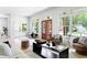 Bright living room showcasing front door, large windows, and modern furniture at 2808 Hosea L Williams Dr, Atlanta, GA 30317