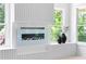 Stylish fireplace feature wall with natural light and additional interior design details at 2808 Hosea L Williams Dr, Atlanta, GA 30317