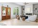 Bright living room with fireplace, built-in shelving, and large front windows at 2808 Hosea L Williams Dr, Atlanta, GA 30317