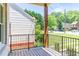 Relaxing covered porch with wooden floors and views of the green, landscaped yard at 2808 Hosea L Williams Dr, Atlanta, GA 30317