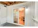 Back patio featuring a sliding glass door with dining room view and wooded backyard at 3076 Montheath Pass, Duluth, GA 30096