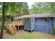 View of the backyard with a deck and blue siding at 3076 Montheath Pass, Duluth, GA 30096