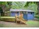 Back of house featuring a multi-tiered deck, fenced yard, and a large grassy area at 3076 Montheath Pass, Duluth, GA 30096