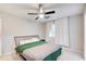 Bedroom featuring a ceiling fan, neutral walls, and a comfortable bed at 3076 Montheath Pass, Duluth, GA 30096