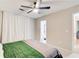 Bedroom with an ensuite bathroom with great natural light and ceiling fan at 3076 Montheath Pass, Duluth, GA 30096