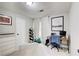 Comfortable bedroom with neutral walls, carpet flooring, and a dedicated workspace at 3076 Montheath Pass, Duluth, GA 30096