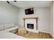 Cozy living room with a fireplace and comfortable seating arrangement at 3076 Montheath Pass, Duluth, GA 30096