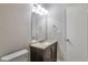 This bathroom boasts a granite countertop and ample lighting above the vanity at 5577 Whittondale Rd, Lithonia, GA 30058