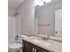 This is a bathroom featuring tile walls, a granite countertop, and a vanity at 5577 Whittondale Rd, Lithonia, GA 30058