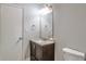 Bathroom featuring a dark vanity, granite counter, modern mirror and lighting at 5577 Whittondale Rd, Lithonia, GA 30058