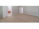 Bedroom features neutral carpet and leads to an ensuite bathroom and closet at 1346 Upshur Pl, Buford, GA 30519