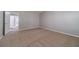 Bedroom features neutral carpet and access to a hallway and closet at 1346 Upshur Pl, Buford, GA 30519