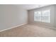 Bedroom with soft walls and carpet floor offering a comfortable retreat to recharge and rejuvenate at 1346 Upshur Pl, Buford, GA 30519