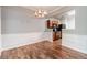 Cozy dining area adjacent to the kitchen, featuring classic chandelier at 1346 Upshur Pl, Buford, GA 30519