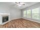 Comfortable living room featuring a fireplace and hardwood flooring at 1346 Upshur Pl, Buford, GA 30519