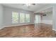 Bright living room featuring hardwood floors and ample natural light at 1346 Upshur Pl, Buford, GA 30519