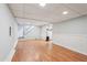 This unfurnished basement features laminate flooring, recessed lighting, and neutral walls at 1952 Winding Creek Sw Ln, Marietta, GA 30064