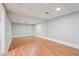 This unfurnished basement features laminate flooring, recessed lighting, and neutral walls at 1952 Winding Creek Sw Ln, Marietta, GA 30064