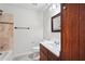 Cozy bathroom includes a tiled shower and dark wood vanity at 1952 Winding Creek Sw Ln, Marietta, GA 30064