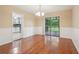 Dining room features hardwood floors and sliding glass doors that lead to a screened-in porch at 1952 Winding Creek Sw Ln, Marietta, GA 30064