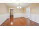 Bright dining room with hardwood floors and white wainscoting at 1952 Winding Creek Sw Ln, Marietta, GA 30064